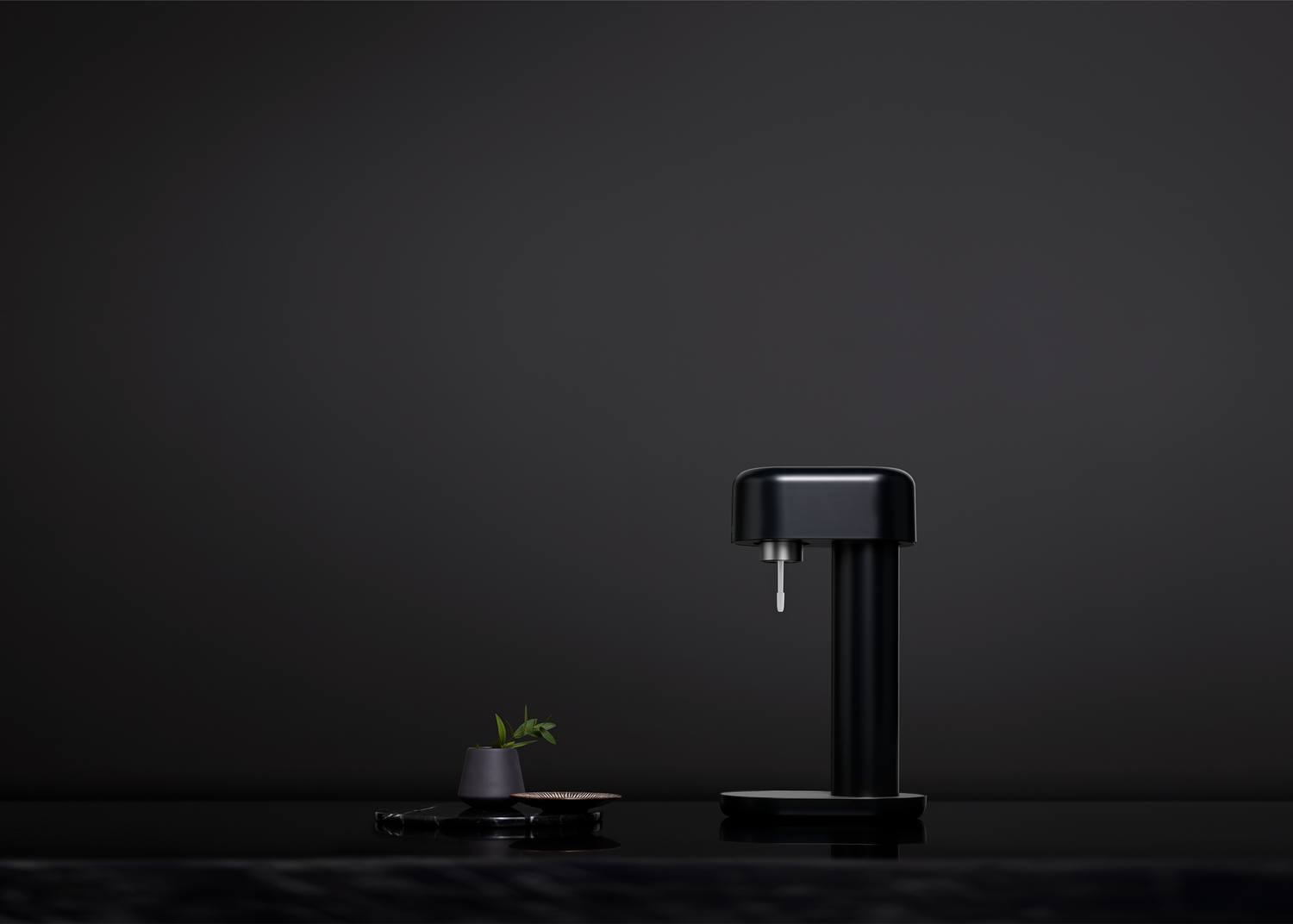 A black Ruby sparkling water maker on an all black background