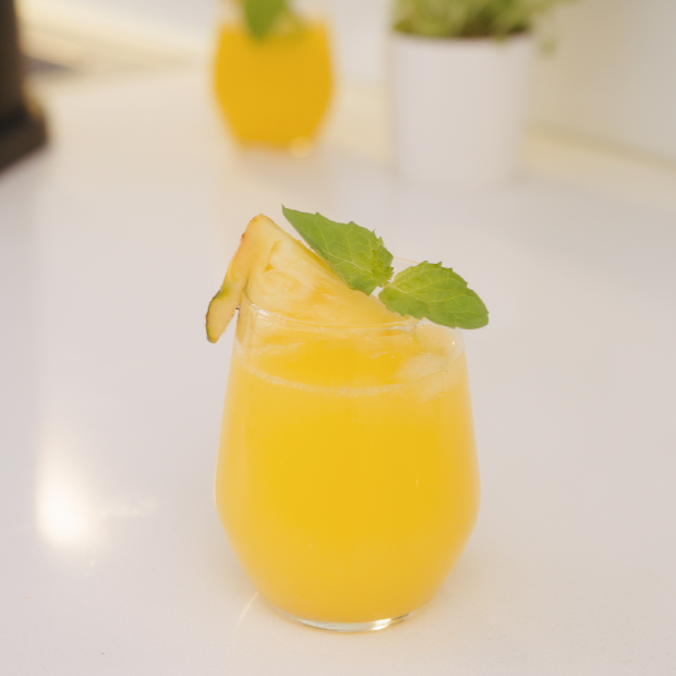 A glass of fresh pineapple cocktail without alcohol