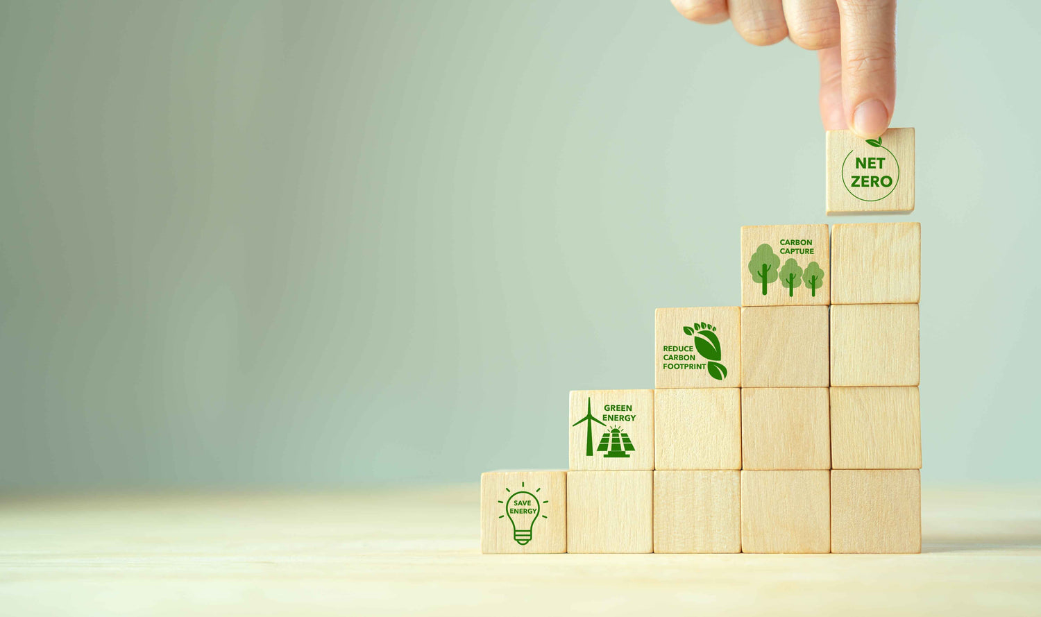Stacked blocks representing sustainable actions on the road towards net-zero