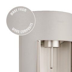 Glassy claysparkling water maker with a close-up bubble showing the subtly visible wood fibres on the device's surface