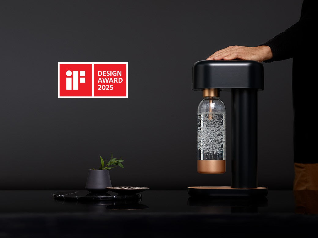 A black and copper Ruby 2 sparkling water maker on dark background with the logo for the iF Design Award 2025