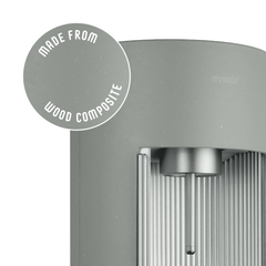 Glassy pigeon sparkling water maker with a close-up bubble showing the subtly visible wood fibres on the device's surface