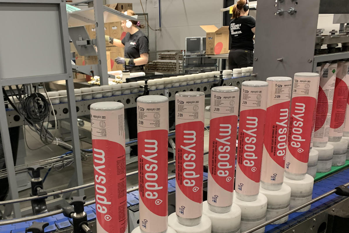Several Mysoda CO2 cylinders on the production line at the Helsinki filling plant