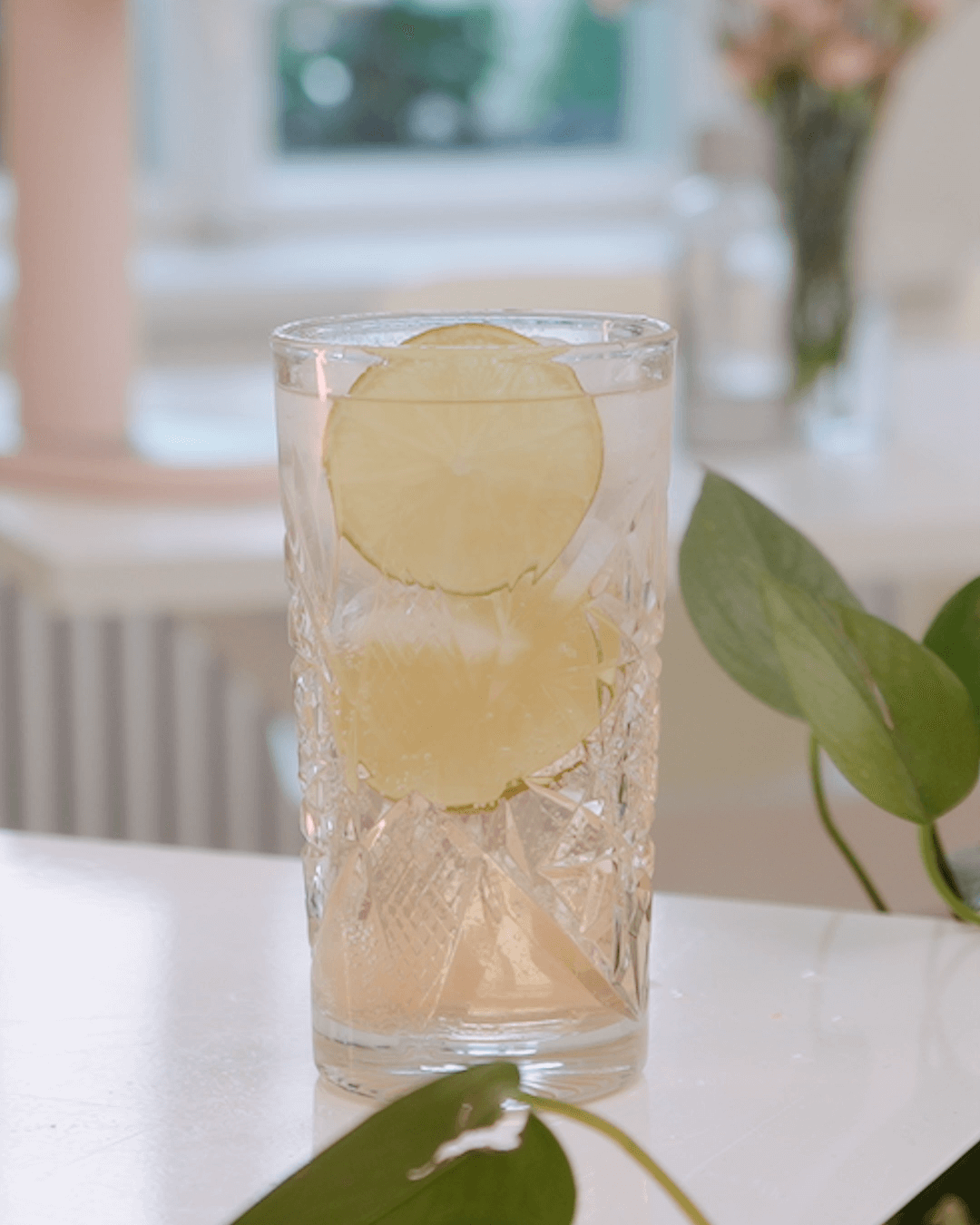 A tall glass of rhubarb mocktail bubbly drink