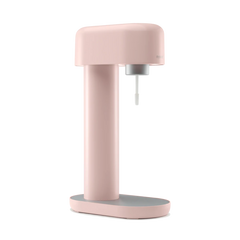 A pink Ruby sparkling water maker viewed from the side