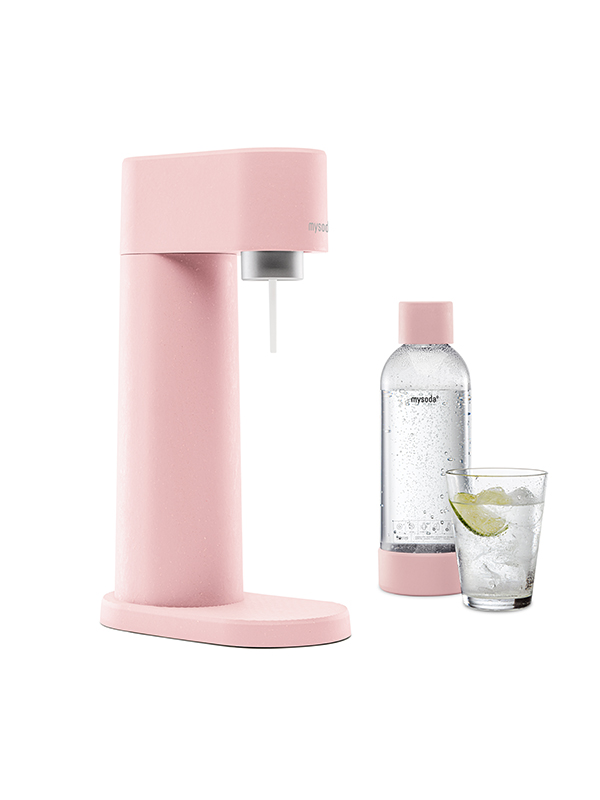 A Mysoda Woody sparkling water maker, colour pink, with bottle and a glass of water viewed from the side.