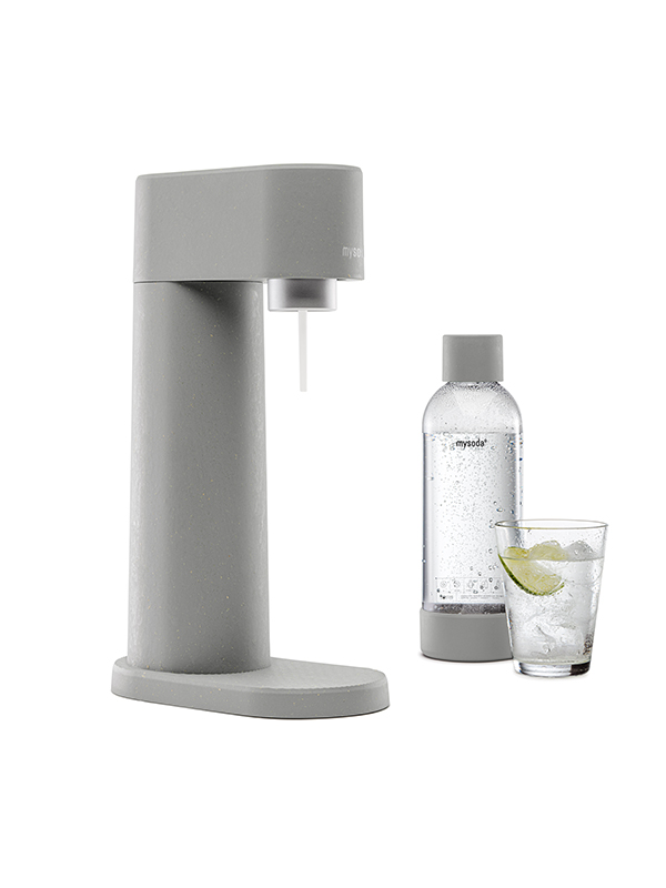 A Mysoda Woody sparkling water maker, colour gray, with bottle and a glass of water viewed from the side.